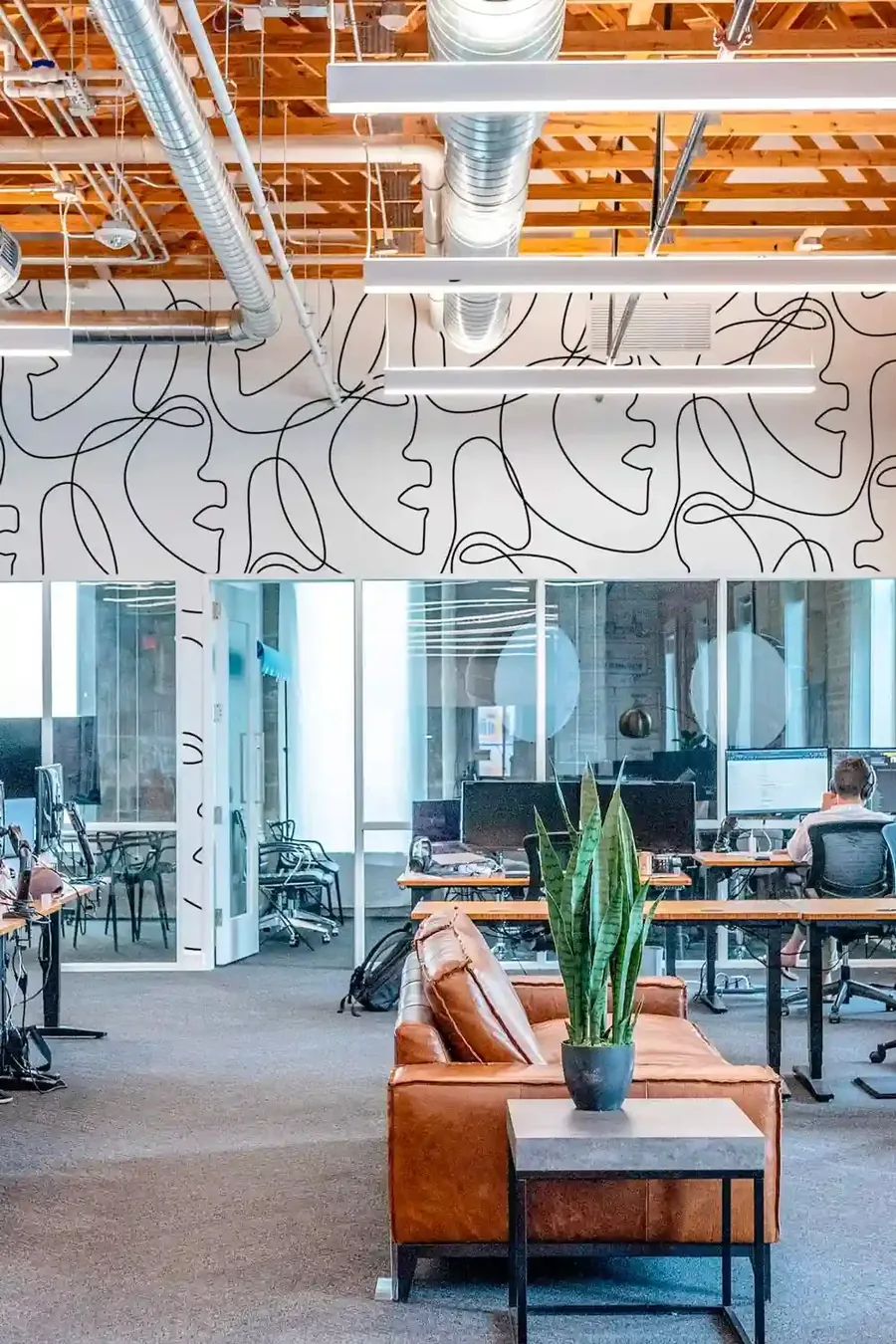 Open-plan office with commercial wallcovering and branded graphics