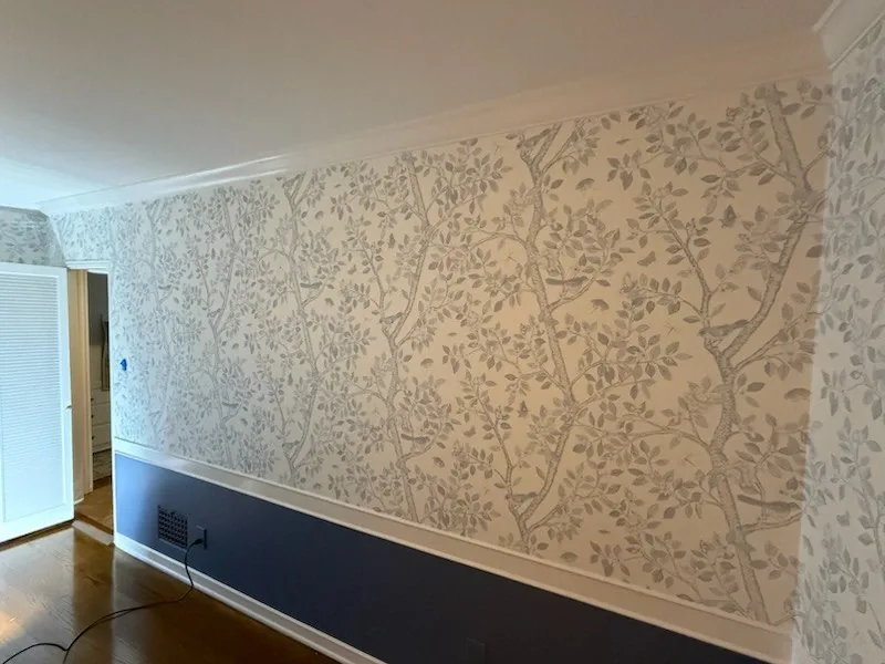 Blush floral wallpaper installed in a residential bedroom by Valora